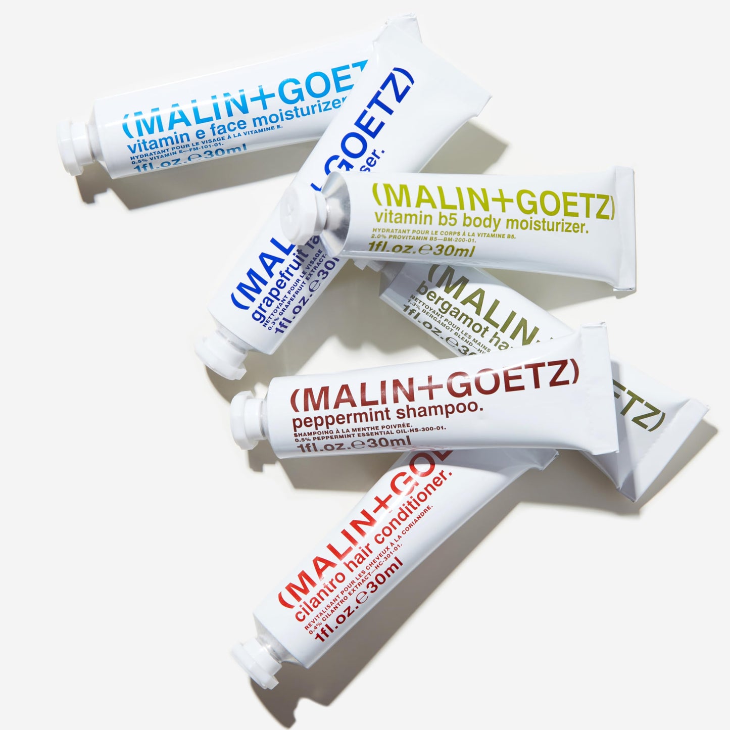 MALIN+GOETZ Best-Sellers Travel Kit | Six Everyday Essentials for Face, Body + Hair | Grapefruit Face Cleanser, Vitamin E Face Moisturizer, Peppermint Shampoo + More | Vegan, Travel-Friendly(6 x 1 oz)