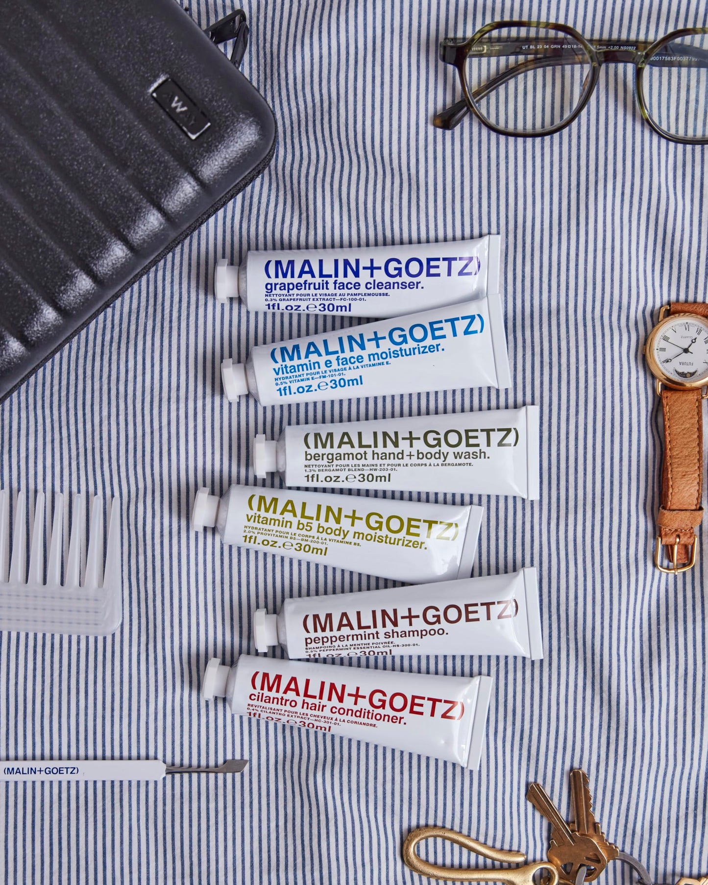 MALIN+GOETZ Best-Sellers Travel Kit | Six Everyday Essentials for Face, Body + Hair | Grapefruit Face Cleanser, Vitamin E Face Moisturizer, Peppermint Shampoo + More | Vegan, Travel-Friendly(6 x 1 oz)