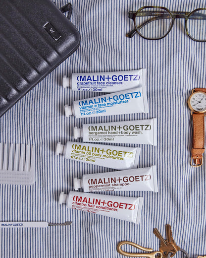 MALIN+GOETZ Best-Sellers Travel Kit | Six Everyday Essentials for Face, Body + Hair | Grapefruit Face Cleanser, Vitamin E Face Moisturizer, Peppermint Shampoo + More | Vegan, Travel-Friendly(6 x 1 oz)